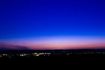  Nightsky with Stars, Moon, and Aurora, Northern Lights over Leiblfing Lower Bavaria Germany.
