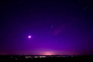 Nightsky with Stars, Moon, and Aurora, Northern Lights over Leiblfing Lower Bavaria Germany.