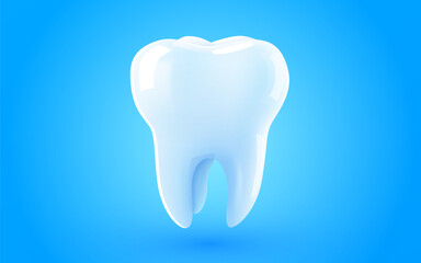 Tooth isolated on blue background. Dentistry concept.
