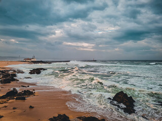 Fototapeta premium Seaside Calmness: Waves Among the Rocks