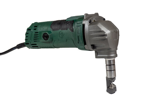 Nibbler isolated on a white background. Electric tool for precise cutting of metals and other material sheets. Cutter suitable for clean, straight and curved cuts with low material wastage