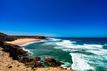 Sandy beach and blue sky Portugal, Algarve, Monte Clerigo praia
