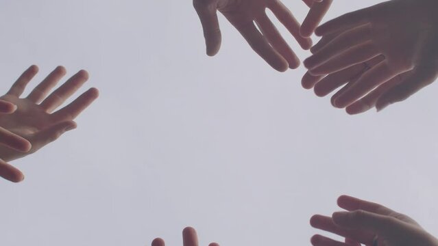 Human hands close up, fingers movement, people group somatic therapy to self-discovery, emotional healing, and personal growth, connection between body and mind. Refuges and ptsd trauma psychotherapy.