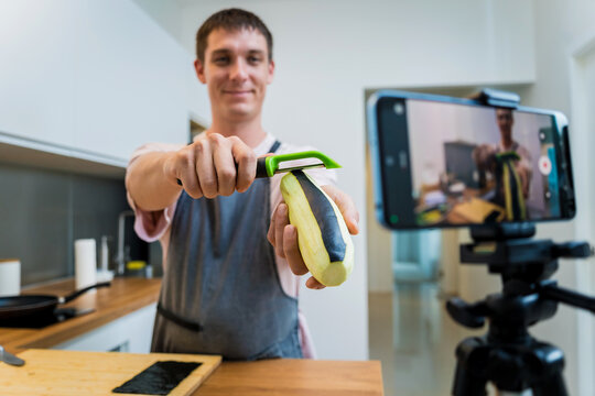The chef is broadcasting live from workshop how to prepare a grilled eggplants with garlic
