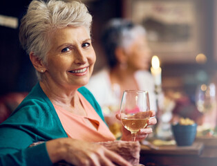 Senior woman, smile and portrait with wine in restaurant for fun, vacation and dinner by friends. Elderly person, happiness and relax in diner for drinks, holiday and social celebration with memory