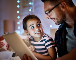 Dad, daughter and tablet in bedroom at night for reading, storytelling and learning on website or ebook app. Child, family and father or man on digital tech at home for paperless education or bonding