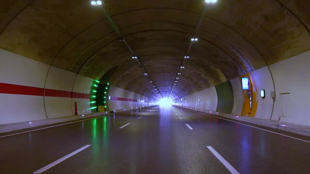 vehicle travelling inside the empty tunnel