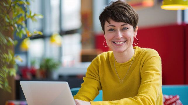 Smiling Web Designer Photo Shoot, Professional Environment, Diverse Workforce, Corporate Photography, Team Collaboration, Engaged Employees, Authentic Work Settings.