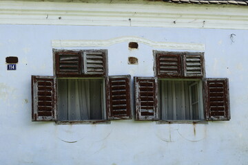 Old building with stripped shutters