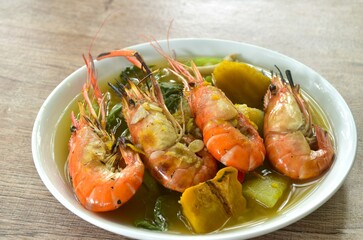 boiled spicy mixed vegetable topping grilled river shrimp soup on plate