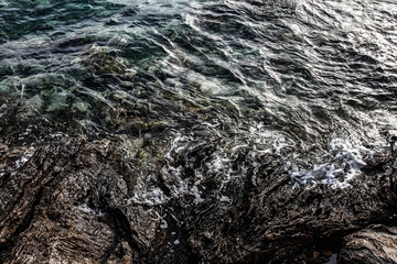 Sea stones on the beach in the sand. Sea landscape. 