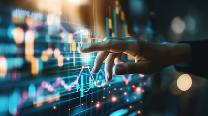 Close-up of a hand interacting with a futuristic digital screen displaying data charts and graphs. The image represents data analysis and technology.