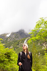 Naklejka premium beautiful girl hiking in the Polish mountains during the summer day
