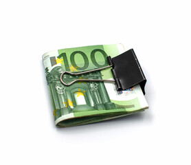 One hundred euro banknotes clamped with a metal clip