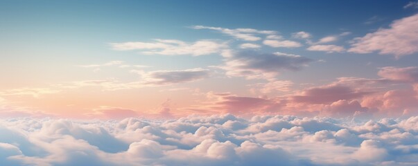 Obraz premium Dreamy cloudscape with soft pink and blue hues at sunset.