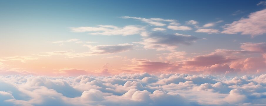Dreamy cloudscape with soft pink and blue hues at sunset.