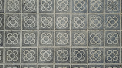 Gray decorative ceramic tiles with floral patterns, suitable for architecture, interior design, and home renovation concepts Spain Barcelona