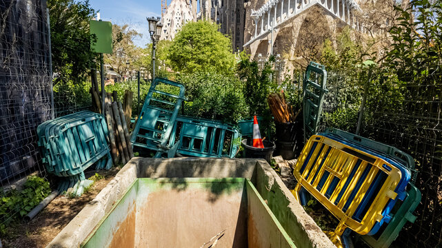 Warehouse of colored fencing stacked in one place in the park
, with a hint of city architecture in the background