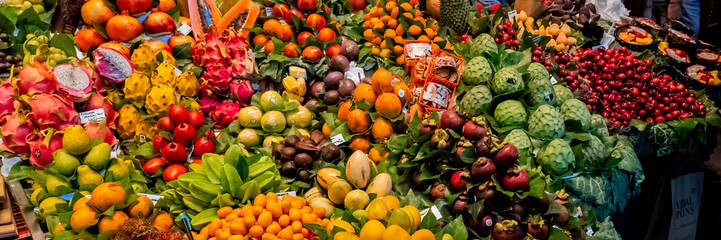 Vibrant farmers market stall brimming with fresh, exotic fruits, perfect for healthy eating and nutrition concepts, and related to harvest festivals