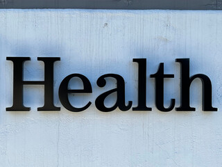 HEALTH signage  in large letters on a building wall