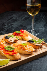 different canape on the wooden tray