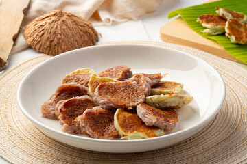 Thai sweet dessert,Coconut Flour Pancakes in white plate.(kanom babin)