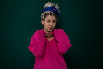 Woman in Pink Sweater Holding Hands to Face