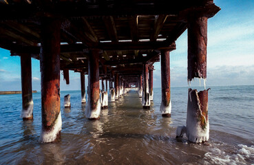 Old iron pier on the Black Sea near Odessa in winter, Ukraine