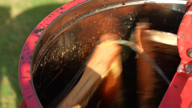 honey harvesting with honey milking machine, close-up