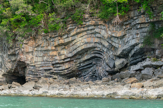 Amazing hillside cliff with compressed layer rock structure or call Pancake rock in the nature geological. 