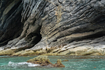 Amazing hillside cliff with compressed layer rock structure or call Pancake rock in the nature geological. 