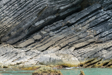 Amazing hillside cliff with compressed layer rock structure or call Pancake rock in the nature geological. 