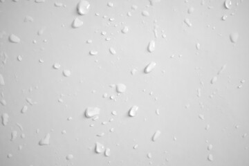 Water drops on white wall background texture