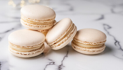 Fototapeta premium Delicious macarons on white marble table. French dessert. Sweet and tasty food.