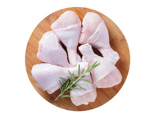 fresh chicken legs with rosemary on wooden board isolated on transparent background, top view
