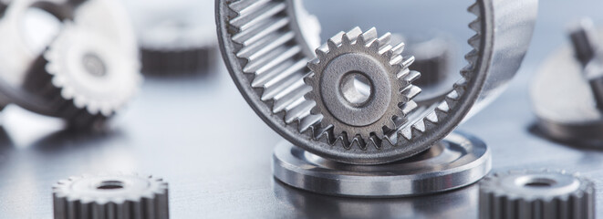 metal gears and bearings. Background with part of the mechanism.