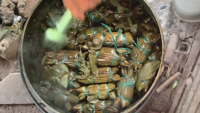 Buras or Burasa, Bugis Makassar traditional food made from coconut milk rice wrapped in banana leaf and boiled. Traditional kitchen in rural life.