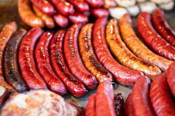 Roasted sausages on fire, meat barbecue