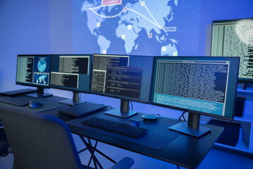 Cyber security command center with multiple monitors displaying data analysis and network information