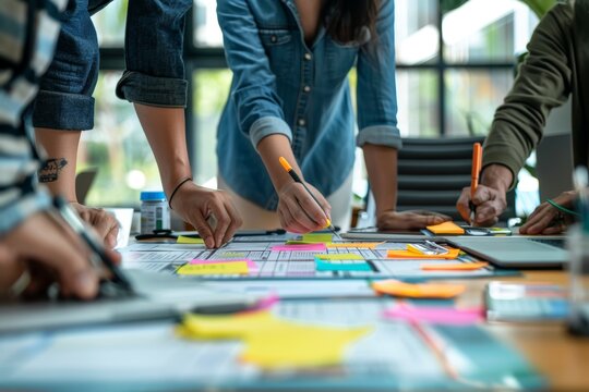 Creative agency team discusses product launch roadmap for new business development