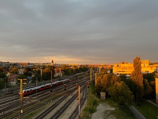 Golden hour over the City with rails and trains. 