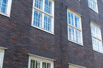 brick house wall with even windows
