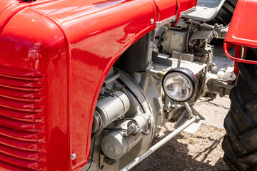 Red retro old tractor close up