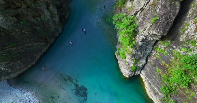 Birds eye view of Shala River Canyon in Shkoder, northern Albania and people crossing the river. 