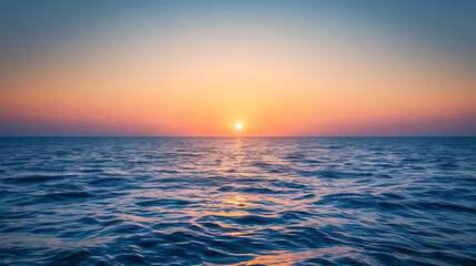 Fototapeta premium Sunrise amidst the ocean, wallpaper, the first light of the day passes through the beautiful waters.