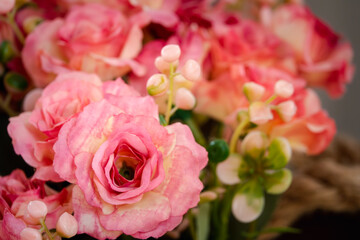 A bouquet of pink flowers with green leaves