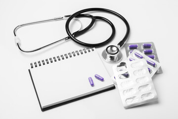 stethoscope equipment and psychotherapy pills melatonin capsule purple healthy on notebook