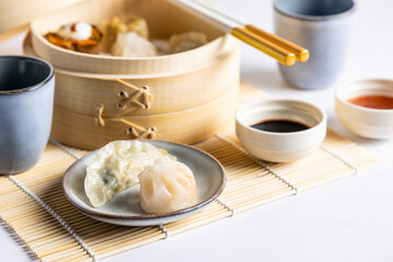 Dim sum steamed in a bamboo basket.