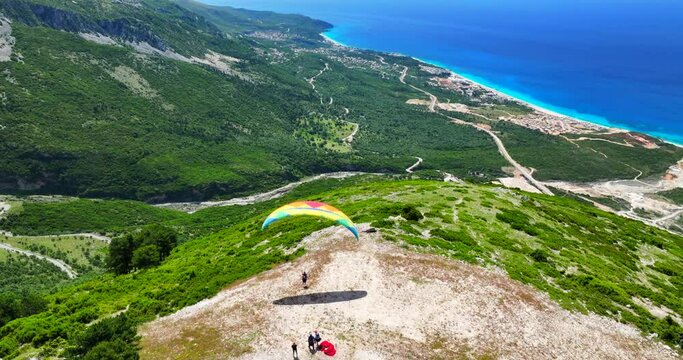 Aerial view of a paraglider taking off from a Llogara pass balcony in Vlore, southern Albania. 
