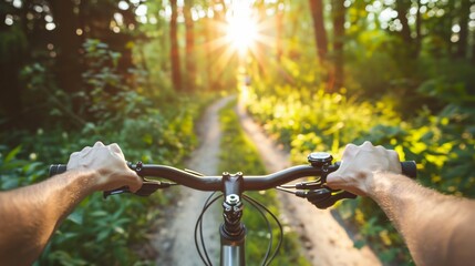 An individual riding a bicycle on a scenic path, with the focus on the handlebars and the person's hands gripping them